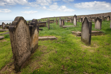 England, North Yorkshire, Tombstones churchyard at St Mary Whitbyの写真素材