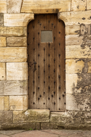 old wooden door inside a castleの写真素材
