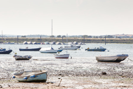 landscape image of boats on the sea taken from west mersea in essex englandの写真素材