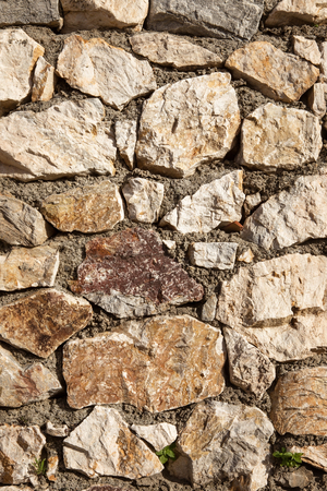 old stone wall wall background backdrop closeupの写真素材