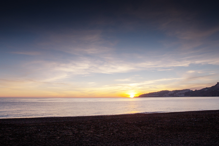 landscape of the sea and beach as the sun is setting in the costa tropical almunecar spainの写真素材