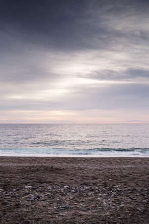 landscape of the sea and beach as the sun is setting in the costa tropical almunecar spainの写真素材