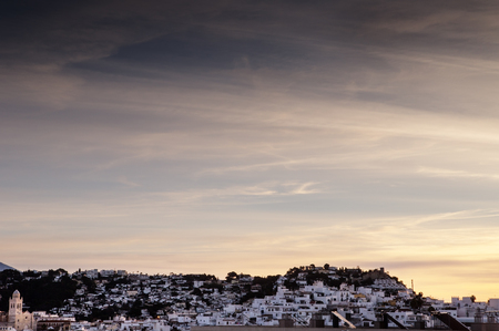 sunrise in almunecar spain with the sun coming up old townの写真素材