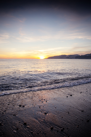 landscape of the sea and beach as the sun is setting in the costa tropical almunecar spainの写真素材