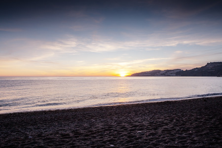 landscape of the sea and beach as the sun is setting in the costa tropical almunecar spainの写真素材