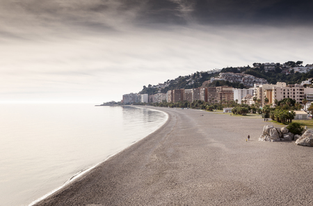 landscape image of the town almunecar in spain showing the beach and the townの写真素材
