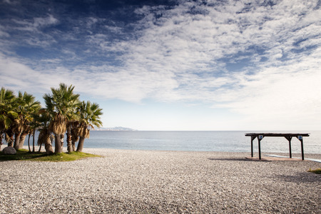 landscape image of a beach in almunecar spain with a disabled spot and cover on the beachの写真素材