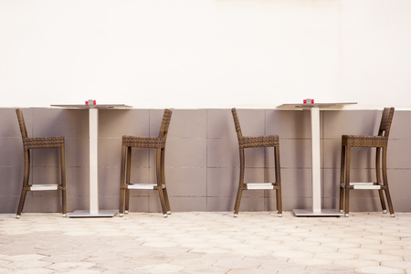 wall outside setup with table and chairsの写真素材