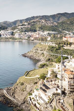 looking down fron a hill top view of building work of a housing estate outside almunecar in spainの写真素材