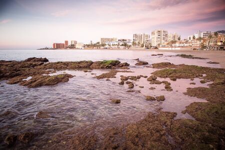 seascape landscape shot in benalmadena with the cityscape distantの写真素材
