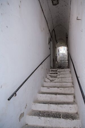 detail of steps going up on a side alleyway in amalfi town cityの写真素材