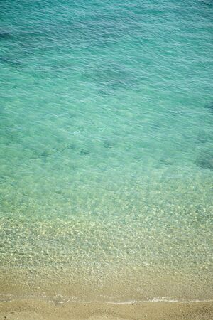 background image sea breaking against the beach from aboveの写真素材