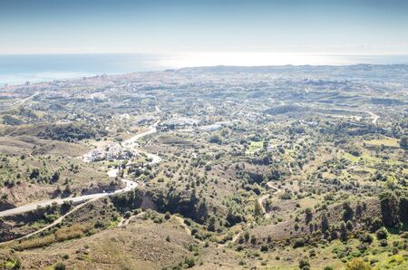view looking out aross the sea from the mountin side town of mijas in spainの写真素材