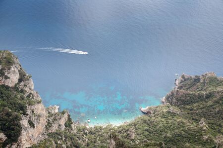 looking down at a bay from  mount solaro the highest point on the island of capri in italyの写真素材