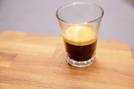 glass of espresso  on a talbe top in italyの写真素材