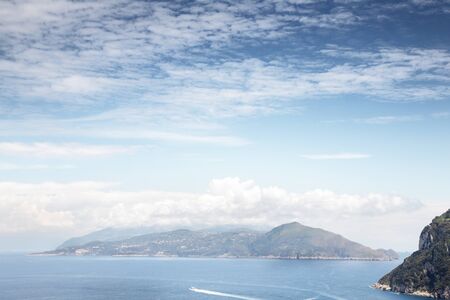 view of mount vesuvius across the sea from the island of capriの写真素材