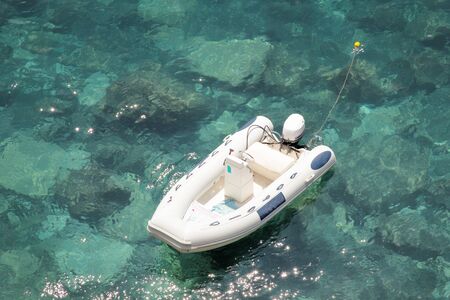 looking down at a small speed boat in the seaの写真素材