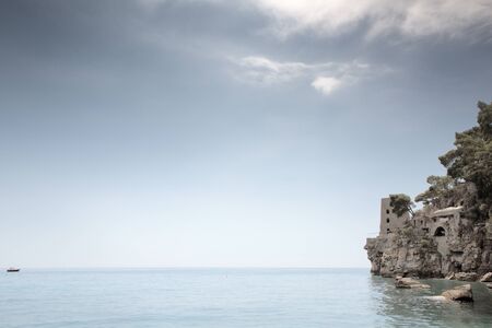 positano beach with a old look out tower in the backgroundの写真素材
