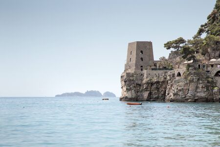 old defence tower on the edge of the sea in positanoの写真素材