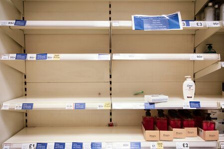 empty shalf sold out of hand sanitizer and soap
