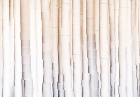 background of toilet roll all stacked up to make a wallの写真素材