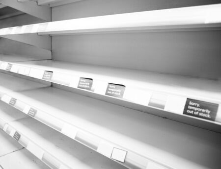 empty shelf in a shop due to panic buyingの写真素材