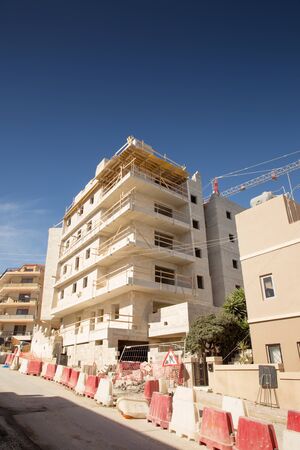 building and construction work of a building site in maltaの写真素材