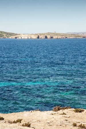 looking out to sea at St Paul Island also know as Selmunett from St Paul bay in maltaの写真素材