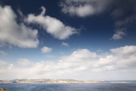 looking out to sea at St Paul Island also know as Selmunett from St Paul bay in maltaの写真素材