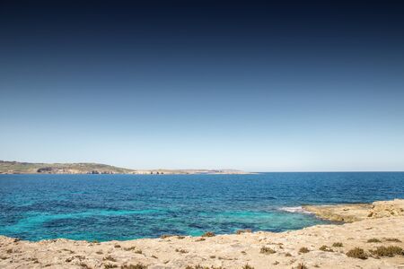 looking out to sea at St Paul Island also know as Selmunett from St Paul bay in maltaの写真素材