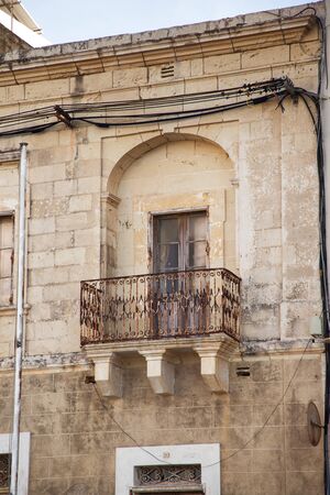 old window balcony in maltaの写真素材