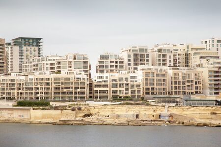 landscape view of a cityscape malta of all the high rise buildingsの写真素材