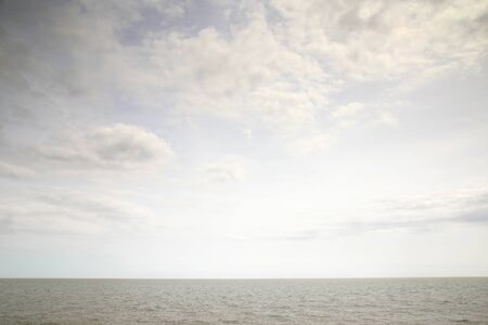 seascape image looking out to sea on a calm and cloudy day in englandの写真素材