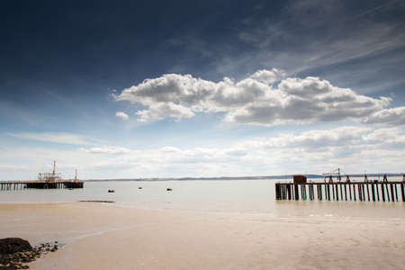 seascape image of a muddy beach by the river thames from canvey island in essexの写真素材