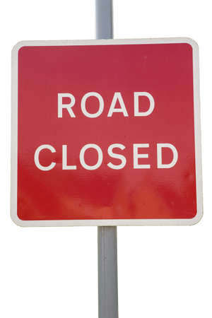 large red closed road sign on white backgroundの写真素材
