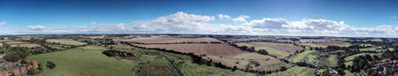 aerial panoramic view landscape image  of the village Castle Acre in Norfolk Englandの写真素材