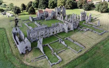 aerial view landscape image of the ruins of  Castle Acre Priory a medieval building in the village of Castle Acre Norfolk Englandのeditorial素材