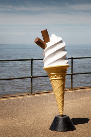 large model of a ice cream cone along the seasideの写真素材