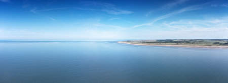 aerial view above the sea looking at the sea side town of Hunstanton in norfolkの写真素材