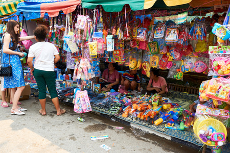LUANG PRABANG, LAOS - APRIL 14, 2019. Local Lao people celebrating Pi Mai, at the market. Lao New Year, big water festivalのeditorial素材