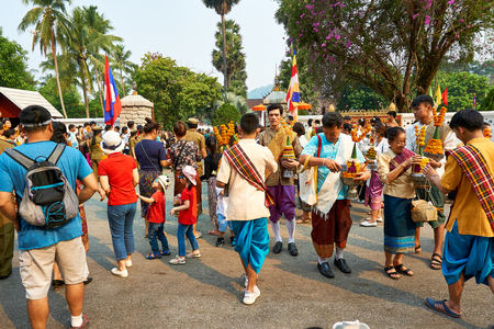 LUANG PRABANG, LAOS - APRIL 17. 2019. Local Lao people celebrating Pi Mai. Lao New Year Parade, festivalのeditorial素材