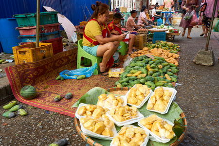 LUANG PRABANG, LAOS - APRIL 17. 2019 : Local lao people selling food at the morning market in Luang...