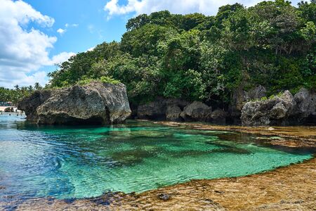 Philippines, Siargao Island, 22.July.2019. Tourists visit magpupungko natural rock pools in Siargao Philippinesのeditorial素材