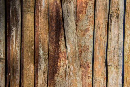 Rusty zinc and bambooの写真素材