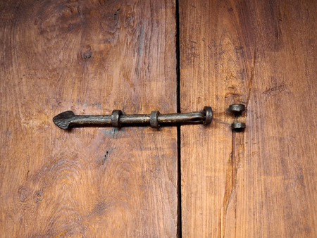 The Old Metal Lock on the Wooden Window