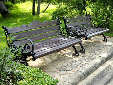 Vintage Black Wood and Metal Benches in the Public Parkの写真素材