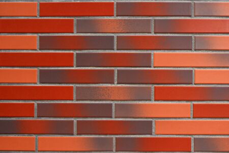 Modern Red, Orange and Brown Brick Wall for Background, Texture and Wallpaperの写真素材