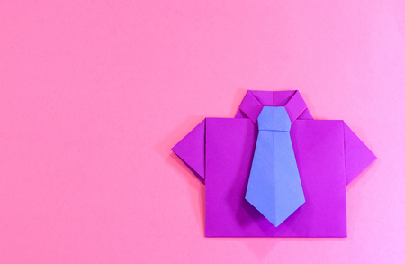Father's day celebration. Origami shirt and tie on pink backgroundの写真素材