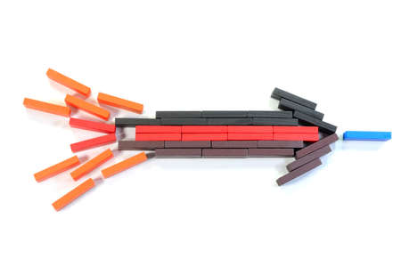 Puzzle pieces joining together to form arrow sign on a white background