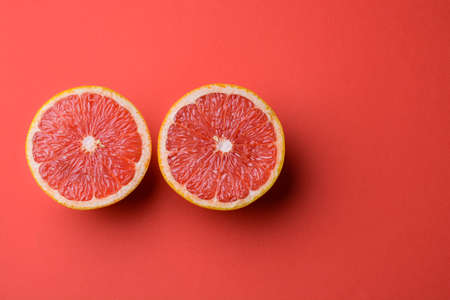 Closeup view of grapefruit on a red background